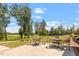 Outdoor patio with comfortable seating and golf course views at 209 Sage Oak Ln, Holly Springs, NC 27540