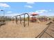 Community playground featuring swings and slides on a sunny day at 209 Sage Oak Ln, Holly Springs, NC 27540