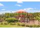 Bright playground with slides and climbing structure surrounded by greenery at 209 Sage Oak Ln, Holly Springs, NC 27540