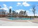 Community pool with lap lanes, pergola, lifeguard stand and various chairs and tables at 209 Sage Oak Ln, Holly Springs, NC 27540