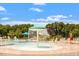 Community pool with mushroom fountain feature, a slide, and many places to sit and enjoy the sun at 209 Sage Oak Ln, Holly Springs, NC 27540