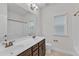 Bright bathroom with white shower, white toilet, and double sink vanity at 216 Pondside Dr, Apex, NC 27539