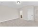Neutral-colored bedroom featuring carpet, light walls, and a ceiling light at 216 Pondside Dr, Apex, NC 27539