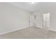 Bright bedroom with carpet and closet and bathroom entrances at 216 Pondside Dr, Apex, NC 27539