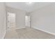 Neutral-colored bedroom with carpet, light walls, and doors to closet and bath at 216 Pondside Dr, Apex, NC 27539