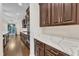Bright, modern kitchen includes quartz countertops and stainless appliances at 216 Pondside Dr, Apex, NC 27539
