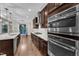 The kitchen showcases stainless appliances, a cooktop, and modern design at 216 Pondside Dr, Apex, NC 27539