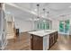 Bright kitchen featuring a large island and an open concept to the living room at 216 Pondside Dr, Apex, NC 27539
