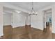 Spacious living room with hardwood floors, wainscoting, and an open layout, perfect for entertaining at 216 Pondside Dr, Apex, NC 27539
