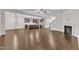 Open floor plan showcasing the living room, fireplace, and the kitchen beyond at 216 Pondside Dr, Apex, NC 27539