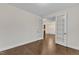 Versatile room with hardwood floors and French doors leading to dining room at 216 Pondside Dr, Apex, NC 27539