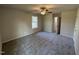 Spacious carpeted bedroom with a ceiling fan and ample natural light at 233 Constellation Ct, Benson, NC 27504
