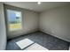 Bright bedroom with a window view and soft gray carpeting at 233 Constellation Ct, Benson, NC 27504