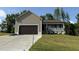 Charming single-Gathering home with a front porch and an attached two-car garage at 233 Constellation Ct, Benson, NC 27504