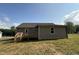 Back exterior view of a home with a wooden deck at 233 Constellation Ct, Benson, NC 27504