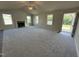 Open-concept living room and kitchen area with fireplace, island, and modern finishes at 233 Constellation Ct, Benson, NC 27504