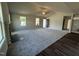 Spacious living room featuring plush carpeting, a fireplace, and plenty of natural light at 233 Constellation Ct, Benson, NC 27504