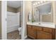 Cozy bathroom features a single sink vanity, and a shower/tub combo with updated fixtures at 2623 Broad Oaks Pl, Raleigh, NC 27603
