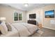 A nicely staged bedroom with good natural lighting, carpet, and neutral colors at 2623 Broad Oaks Pl, Raleigh, NC 27603