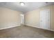 A well-lit room with neutral walls and carpet, offering a blank canvas at 2623 Broad Oaks Pl, Raleigh, NC 27603