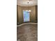 Dining area with a window, neutral paint, wood-look floors, and modern lighting at 2623 Broad Oaks Pl, Raleigh, NC 27603