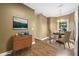 Staged dining area with wood floors, dining table, and dresser at 2623 Broad Oaks Pl, Raleigh, NC 27603