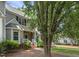 Well-maintained townhome with brick and siding exterior, complemented by mature trees and landscaping at 2623 Broad Oaks Pl, Raleigh, NC 27603