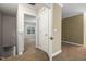Bright hallway with carpeted floors leading to multiple rooms at 2623 Broad Oaks Pl, Raleigh, NC 27603