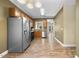 Open kitchen boasts stainless appliances and an adjacent dining area at 2623 Broad Oaks Pl, Raleigh, NC 27603