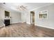 Spacious open-concept living area features hardwood floors, a fireplace and lots of natural light at 2623 Broad Oaks Pl, Raleigh, NC 27603