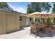 A lovely patio offers a grill, patio furniture, and a large umbrella for shade at 2710 Broad St, Durham, NC 27704