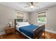 Inviting bedroom features a ceiling fan, hardwood floors, and windows for plenty of natural light at 2710 Broad St, Durham, NC 27704