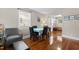 Cozy dining room with hardwood floors, table with chairs, and a view into the living room and entryway at 2710 Broad St, Durham, NC 27704