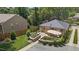 Charming home with a well-maintained patio, inviting outdoor space and a gravel driveway at 2710 Broad St, Durham, NC 27704