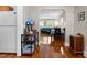 Bright and airy living room features hardwood floors, modern decor, and an open layout to the dining area at 2710 Broad St, Durham, NC 27704