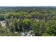 Aerial view showing a neighborhood with large trees and roadways at 2712 Broad St, Durham, NC 27704