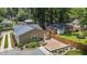 Back of house with a brick patio, landscaping, and a fenced in yard at 2712 Broad St, Durham, NC 27704