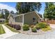 Home exterior showcases manicured landscaping, a gravel driveway, and a well-maintained yard at 2712 Broad St, Durham, NC 27704