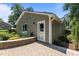The exterior shows a brick patio, lush landscaping, and a well-maintained yard at 2712 Broad St, Durham, NC 27704