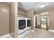 Laundry room with tiled floors, modern washer and dryer, and hallway access to an adjacent room at 2712 Broad St, Durham, NC 27704