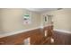 Bright living room with beautiful hardwood floors and natural light at 2712 Broad St, Durham, NC 27704