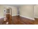 Bright living room with beautiful hardwood floors and neutral paint at 2712 Broad St, Durham, NC 27704