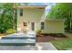 Backyard features a deck area with outdoor seating and a well-maintained yard surrounded by lush greenery at 2721 Rustic Brick Rd, Raleigh, NC 27603