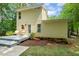 Backyard features a deck area with outdoor seating and a well-maintained yard surrounded by lush greenery at 2721 Rustic Brick Rd, Raleigh, NC 27603