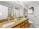 Bright bathroom featuring a double vanity with granite countertop and decorative accents at 2721 Rustic Brick Rd, Raleigh, NC 27603