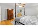 Charming bedroom featuring a four-poster bed, decorative bedding, and a vintage-style wardrobe at 2721 Rustic Brick Rd, Raleigh, NC 27603