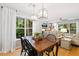 Bright dining area boasts natural light, pendant lighting, and seamless flow into the adjacent living space, perfect for entertaining at 2721 Rustic Brick Rd, Raleigh, NC 27603