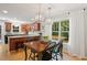 Open concept dining area with natural light, stylish light fixtures, and easy access to the kitchen, ideal for gatherings at 2721 Rustic Brick Rd, Raleigh, NC 27603