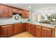 Well-equipped kitchen with granite countertops, stylish backsplash, and stainless steel appliances flows into the dining area at 2721 Rustic Brick Rd, Raleigh, NC 27603