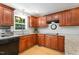 Functional kitchen with ample cabinet space, granite countertops, and stainless steel appliances overlooking the outdoor scenery at 2721 Rustic Brick Rd, Raleigh, NC 27603